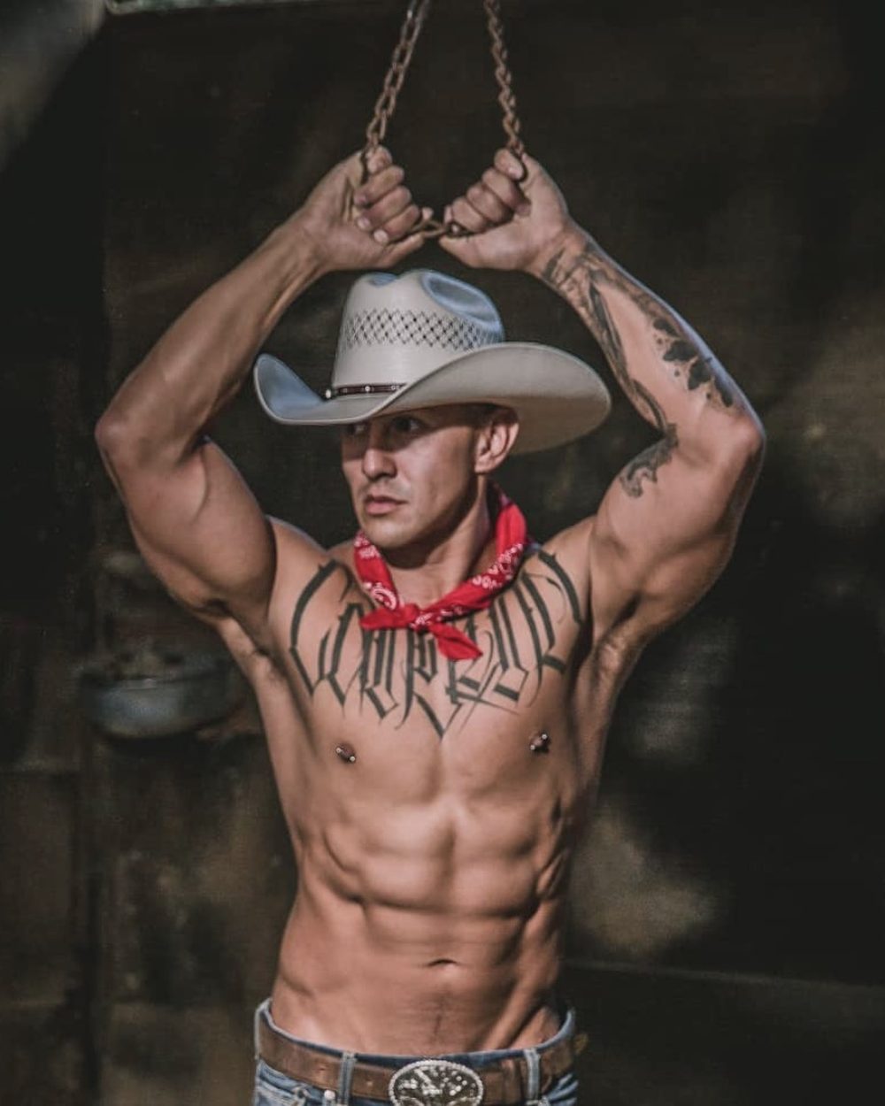 Cocks and Camels male exotic entertainer in dramatic low-key lighting